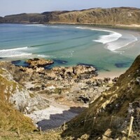 Two fishermen rescued after open-top vessel crashes on rocks