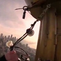 Terrifying video of hanging Christmas lights 600ft off the ground 