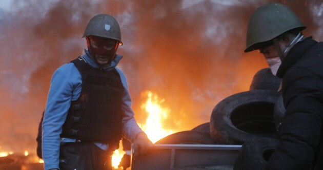 EU adopts sanctions against Ukraine; dozens killed during fighting