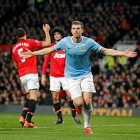 Dzeko downs tepid United to give City derby spoils