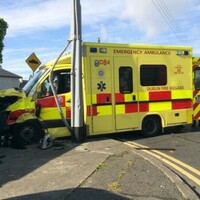 Crew injured after ambulance crashes into wall