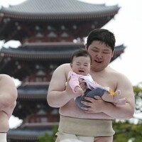 Sumo wrestlers make babies cry on purpose - but that's a good thing