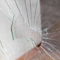 Petrol bombs thrown at bungalow while 70-year-old woman was inside