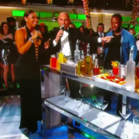 Watch rapper Pitbull fall over after doing a shot on New Year's Eve