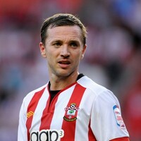 A former Irish international and footballing cult hero has announced his retirement