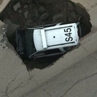 A giant sinkhole ate this police car...