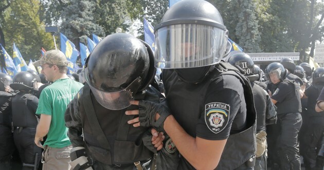 Chaos in Kiev: One killed and dozens injured in clashes outside parliament