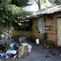 Argentinian man accused of locking his wife and autistic son in a cage for years