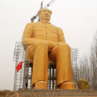 This gargantuan gold statue of Chairman Mao would fit a bus in its pocket
