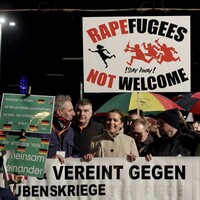 More than 200 arrested after protesters smash cars at anti-refugee rally in Germany