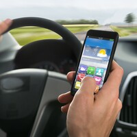 Using WhatsApp, Twitter or Facebook while driving hasn't been completely outlawed yet 
