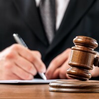 Man who facilitated child pornography of his daughter, filmed by mother, has sentence cut