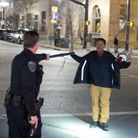 Angry crowds rally after police officer ‘shoots teenager carrying broomstick’