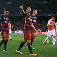 Suarez and Messi shine as Barca put spirited Arsenal to the sword