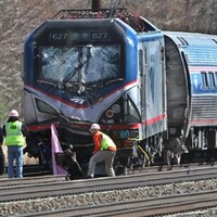 Two dead as train hits digger near Philadelphia