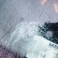 Mother has rock thrown at windscreen while driving on main road