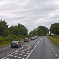 Woman in critical condition after car collides with parked truck