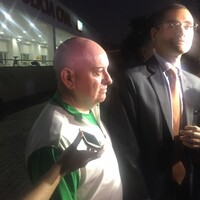 OCI'S Kevin Kilty and Stephen Martin wear Team Ireland kits as they leave Rio police station