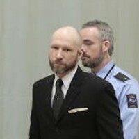 Norwegian mass murderer makes Nazi salute as court reviews 'inhumane' prison regime