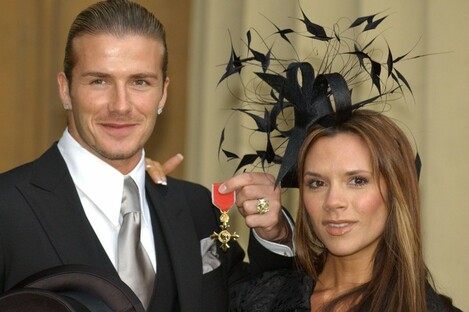 David Beckham with his wife Victoria after receiving the OBE (Officer of the Order of the British Empire) from Queen Elizabeth II at Buckingham Palace in 2003.