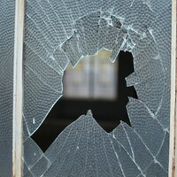 Brick thrown through window lands in baby's cot