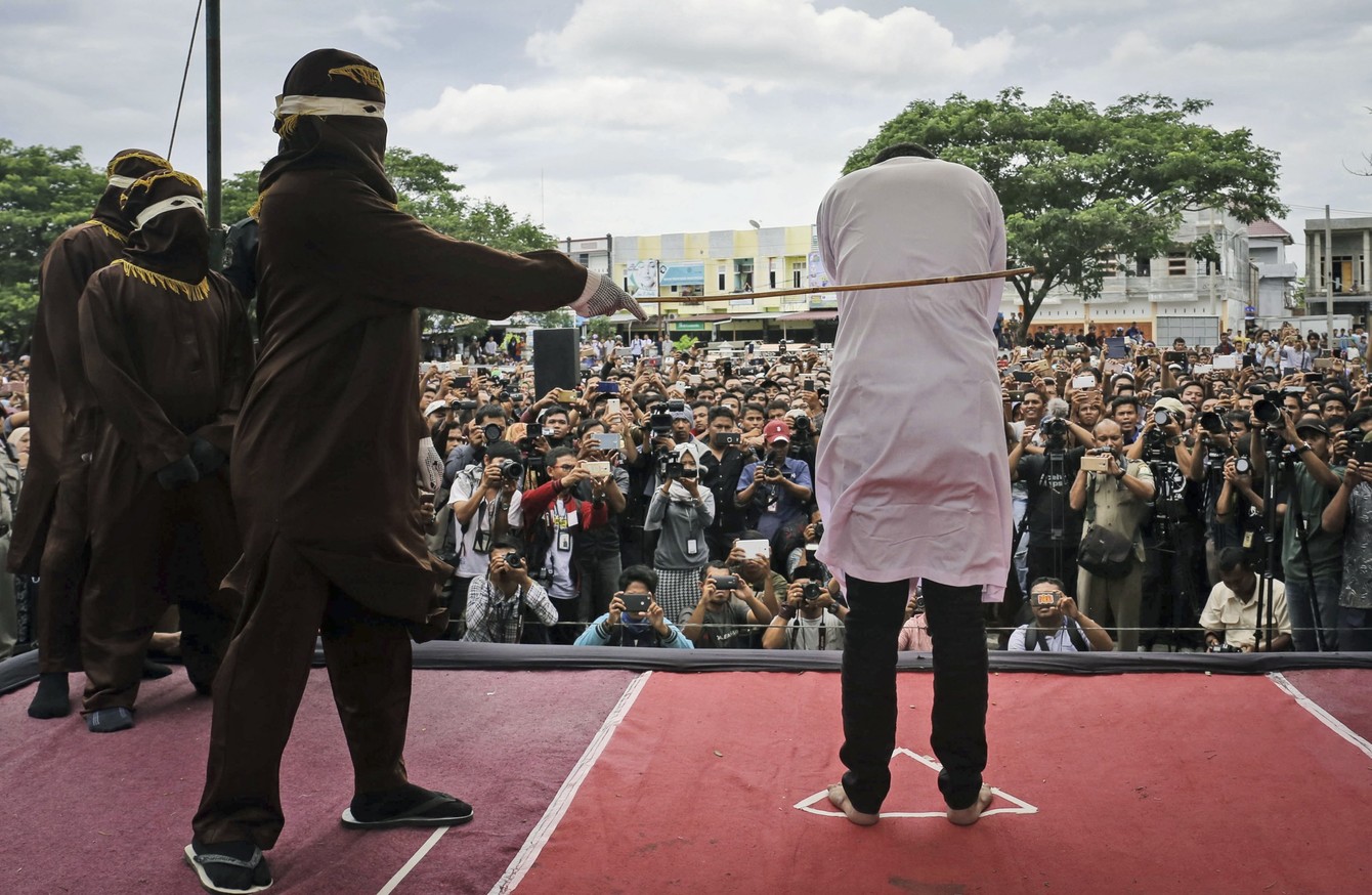 Two Indonesian Men Caned In Front Of Jeering Crowd For