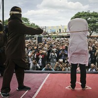 Two Indonesian men caned in front of jeering crowd for having sex