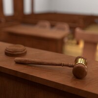 Mother gets 26-year sentence for killing three of her children in Australia