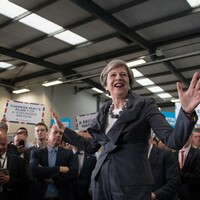 May says she will change human rights laws to fight terrorism