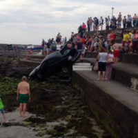 'Runaway' car rolls down steps towards the sea at Kilkee beach