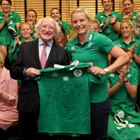 Snap happy! President Michael D Higgins presents the Ireland side with their jerseys 
