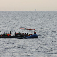 At least 56 people die after human traffickers force 300 off boats and into the sea