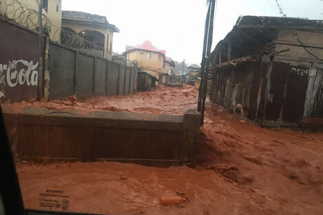 Mud and water burst through the streets of Freetown, Sierra Leone.