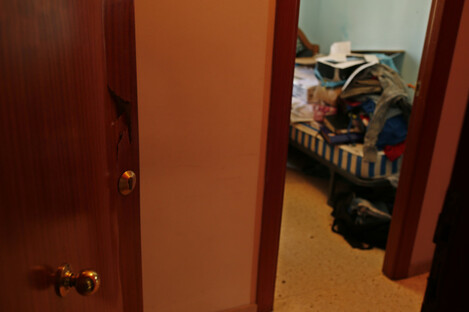 A broken door lies open after a police raid on the house of the Oukabir family where Driss Oukabir and Moussa Oukabir, two possible suspects lived in Ripoll, north of Barcelona, Spain.