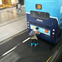'Bus drivers were beeping wildly': Video captures rollerblader hitching ride on back of Dublin Bus