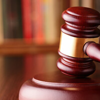 Double-murder trial hears two bullets recovered from skulls of men found in burning car 