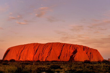 The sun sets at Uluru in the Northern Territory, Australia.