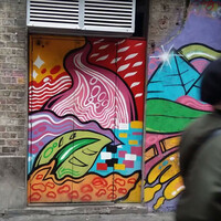 There's an underground poit&Atilde;&shy;n bar behind this mural in Dublin city centre