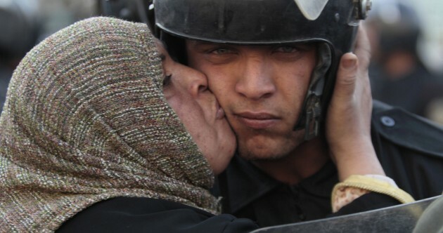 Egypt's under-pressure president sacks cabinet and pledges reform