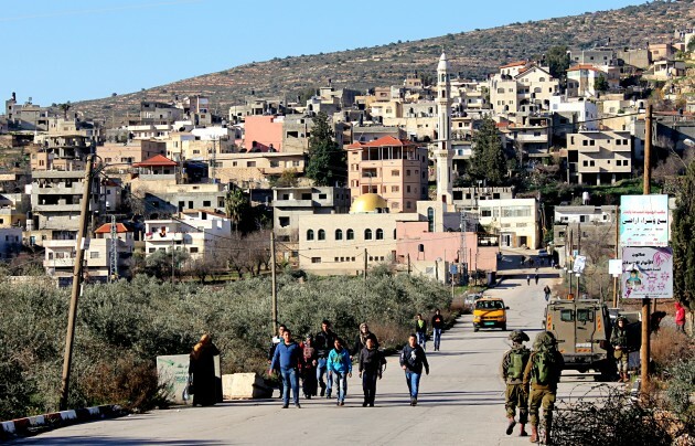 6.1.16, Israeli soldiers establish checkpoint for the children collecting exam results, As-Sawiya School, West Bank. EAPPI_A.Dunne