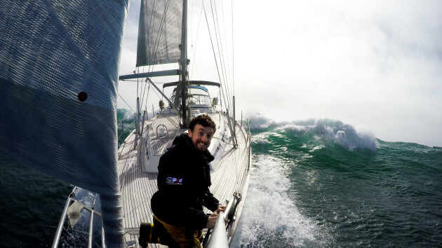 Gregor McGuckin on the bow of boat