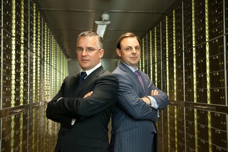 Seamus Fahy and David Walsh, standing in the vault amongst the safety deposit boxes.