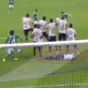 Brazilian player tries to stop low free-kick — by lying down behind the wall