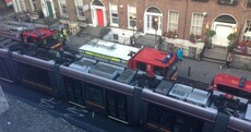 Photos: Luas delays after tram and lorry collide in Dublin city centre