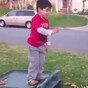 Little kid fails spectacularly at jumping into leaves