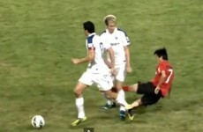 Chinese player's crazy two-footed lunge... on the wrong player