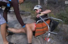 VIDEO: Exhausted cyclist keels over with cramp