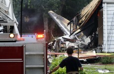 Pics: Plane crashes into houses, four found dead