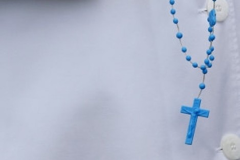 A nun holds Rosary beads at a procession in Knock last May