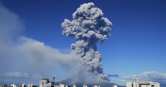 Photos: Clean-up begins after volcanic eruption in Japan coats city in ash